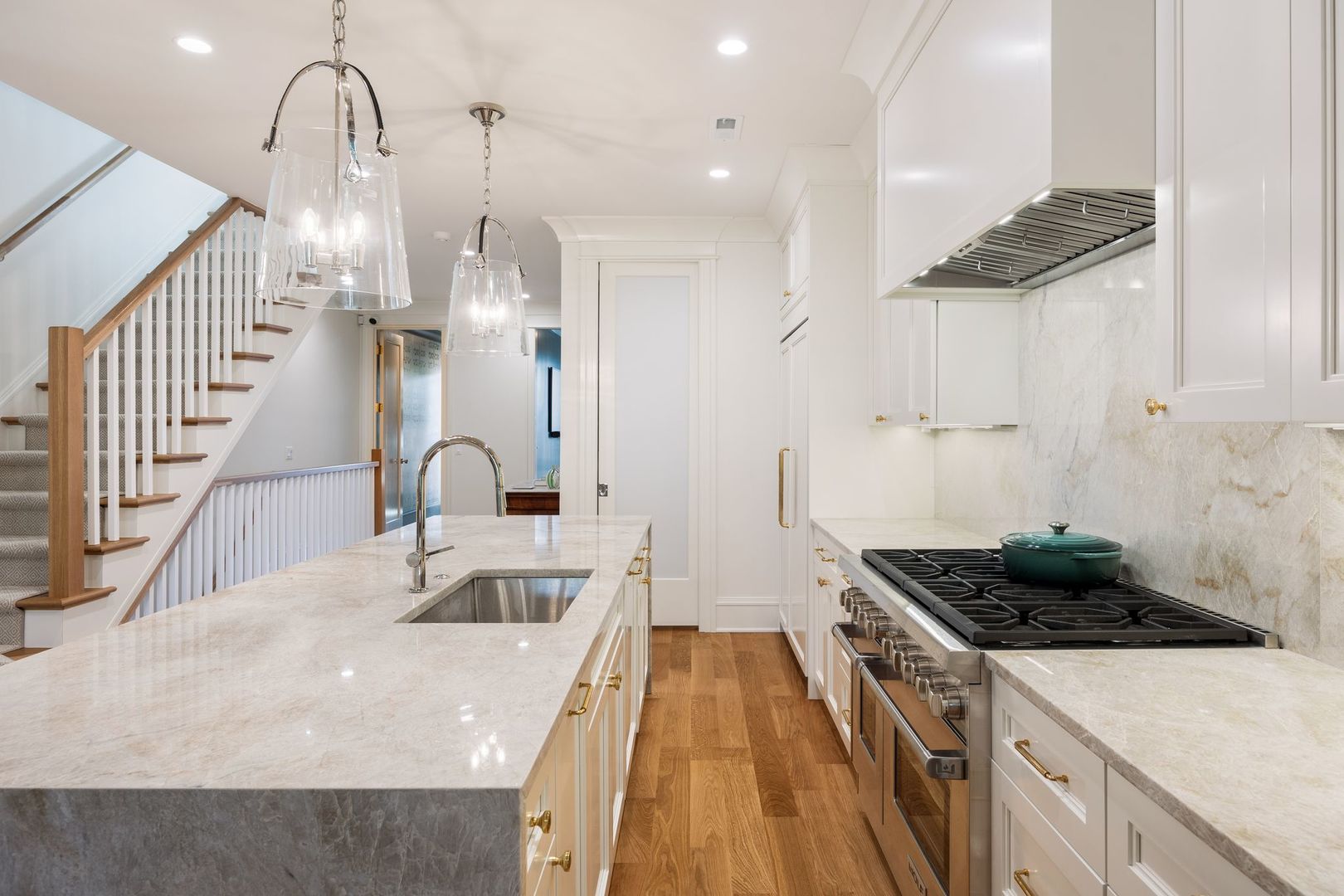 2034 North Mohawk Street, Unit 3 Chicago, IL 60614 - Photo 15 of 46 a kitchen with stainless steel appliances granite countertop a sink a stove and a wooden floors