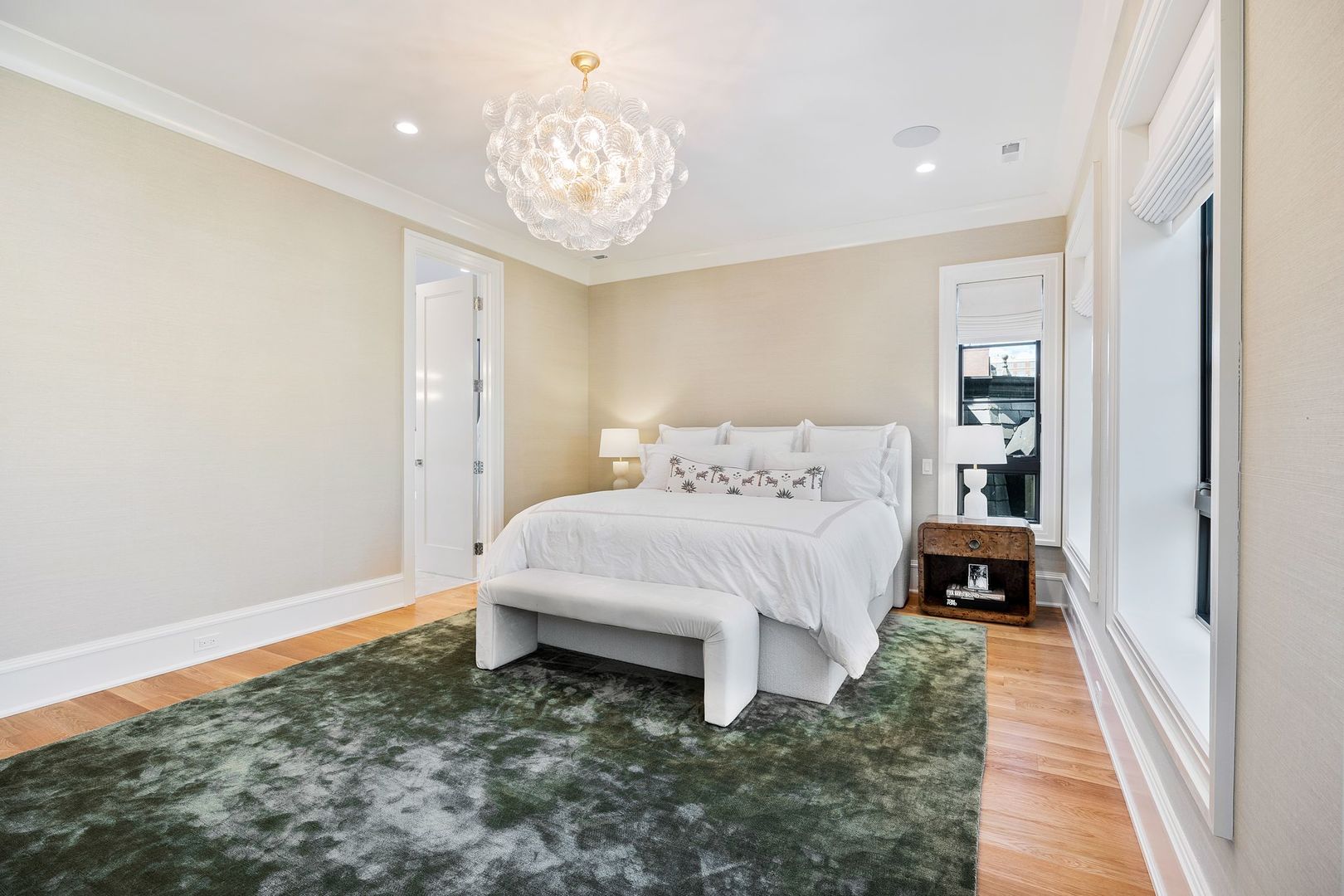 2034 North Mohawk Street, Unit 3 Chicago, IL 60614 - Photo 24 of 46 a bedroom with a bed and a chandelier