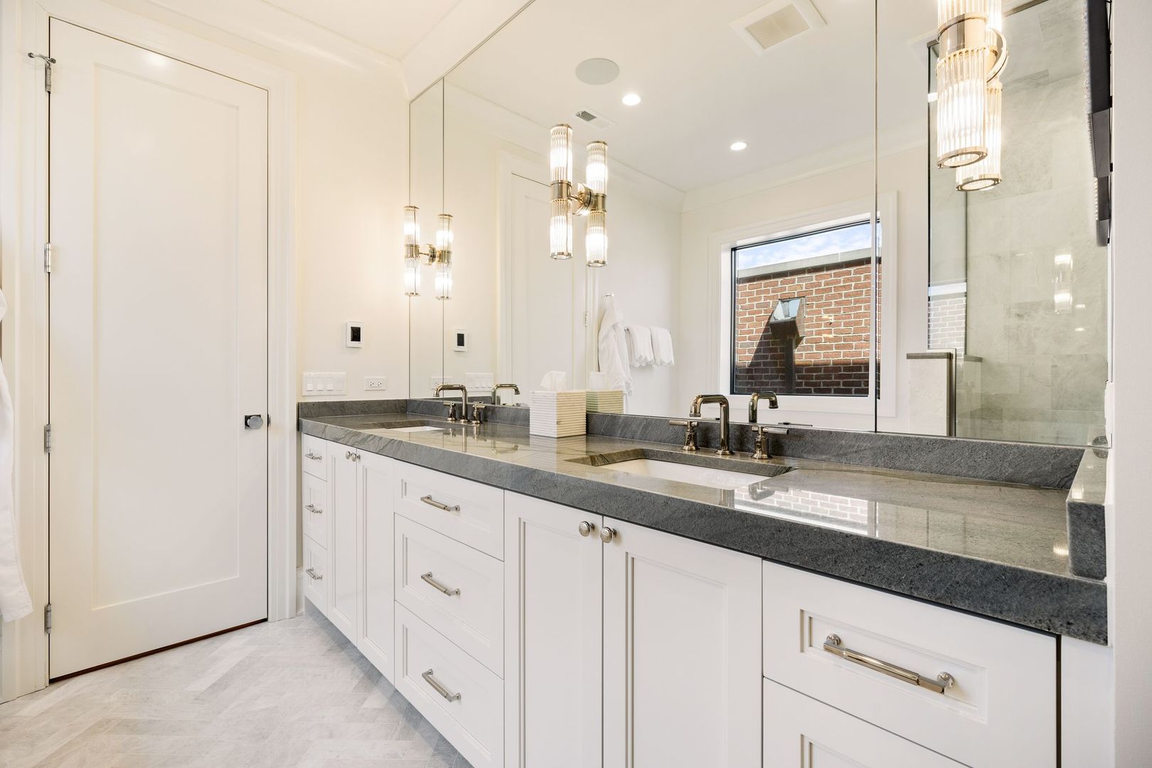 2034 North Mohawk Street, Unit 3 Chicago, IL 60614 - Photo 27 of 46 a bathroom with a granite countertop sink mirror and double