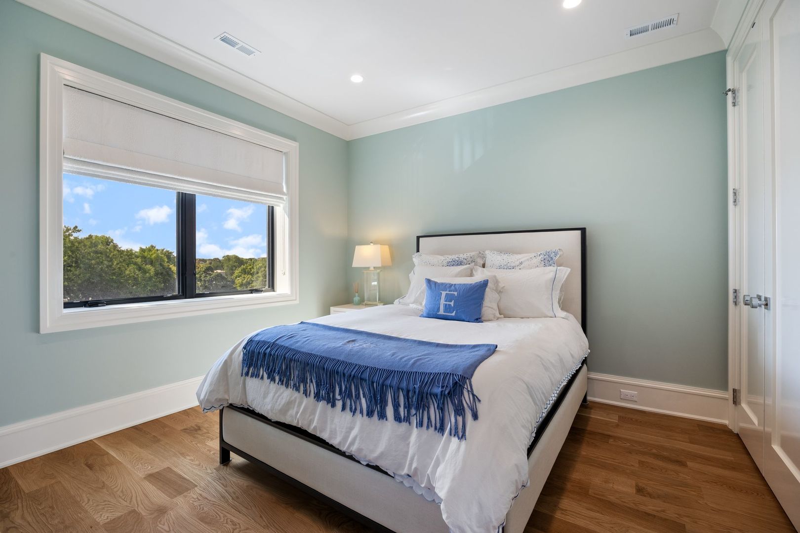 2034 North Mohawk Street, Unit 3 Chicago, IL 60614 - Photo 36 of 46 a bedroom with a bed lamp and window