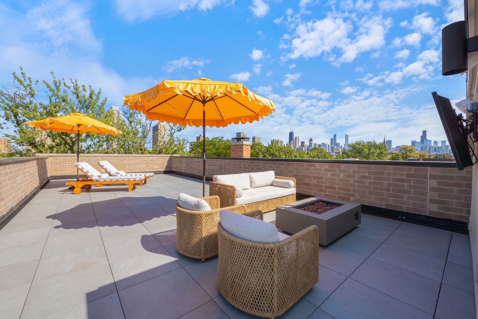2034 North Mohawk Street, Unit 3 Chicago, IL 60614 - Photo 42 of 46 an outdoor sitting area with furniture and umbrella