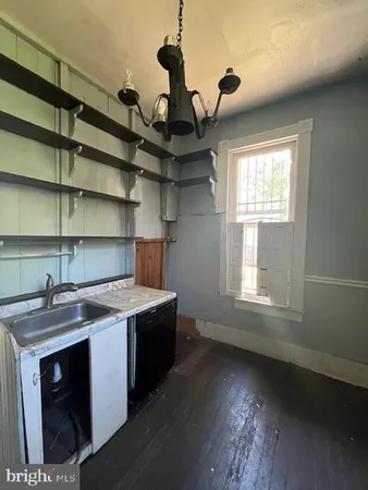 a kitchen with a stove and a sink