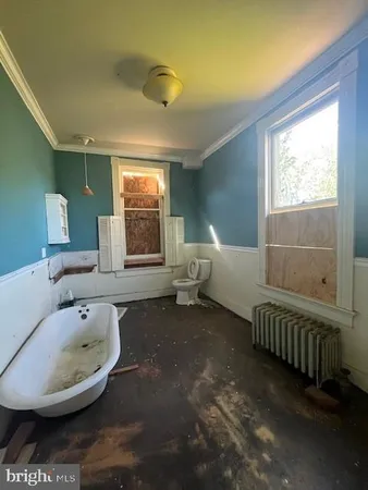 a bathroom with a sink a toilet and a bathtub