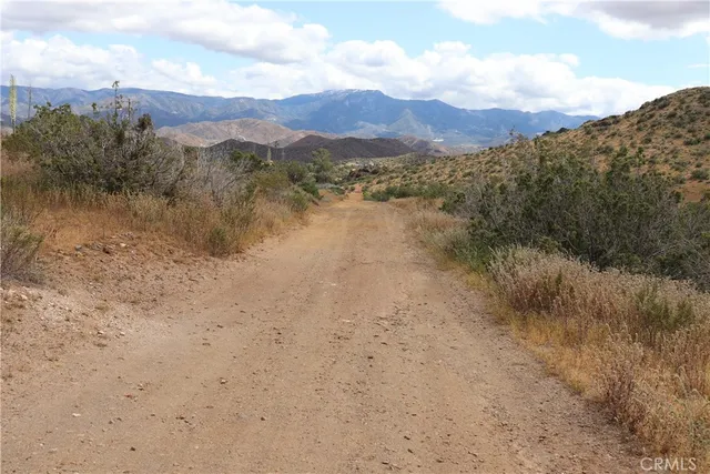a view of lake with green space
