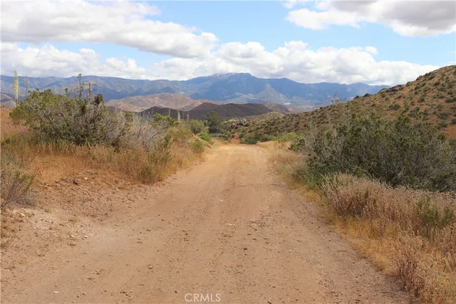 a view of a lake with mountains in the background