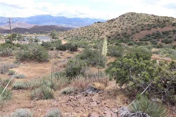 a view of mountains and valleys
