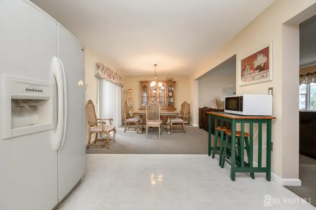 a bathroom with a toilet a sink and a window