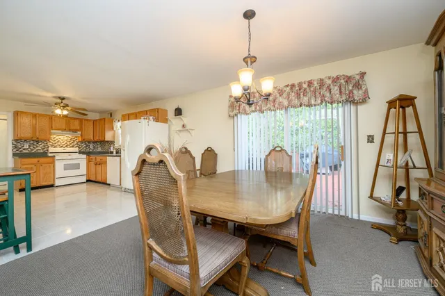 a view of a kitchen with a sink a refrigerator a microwave and a stove