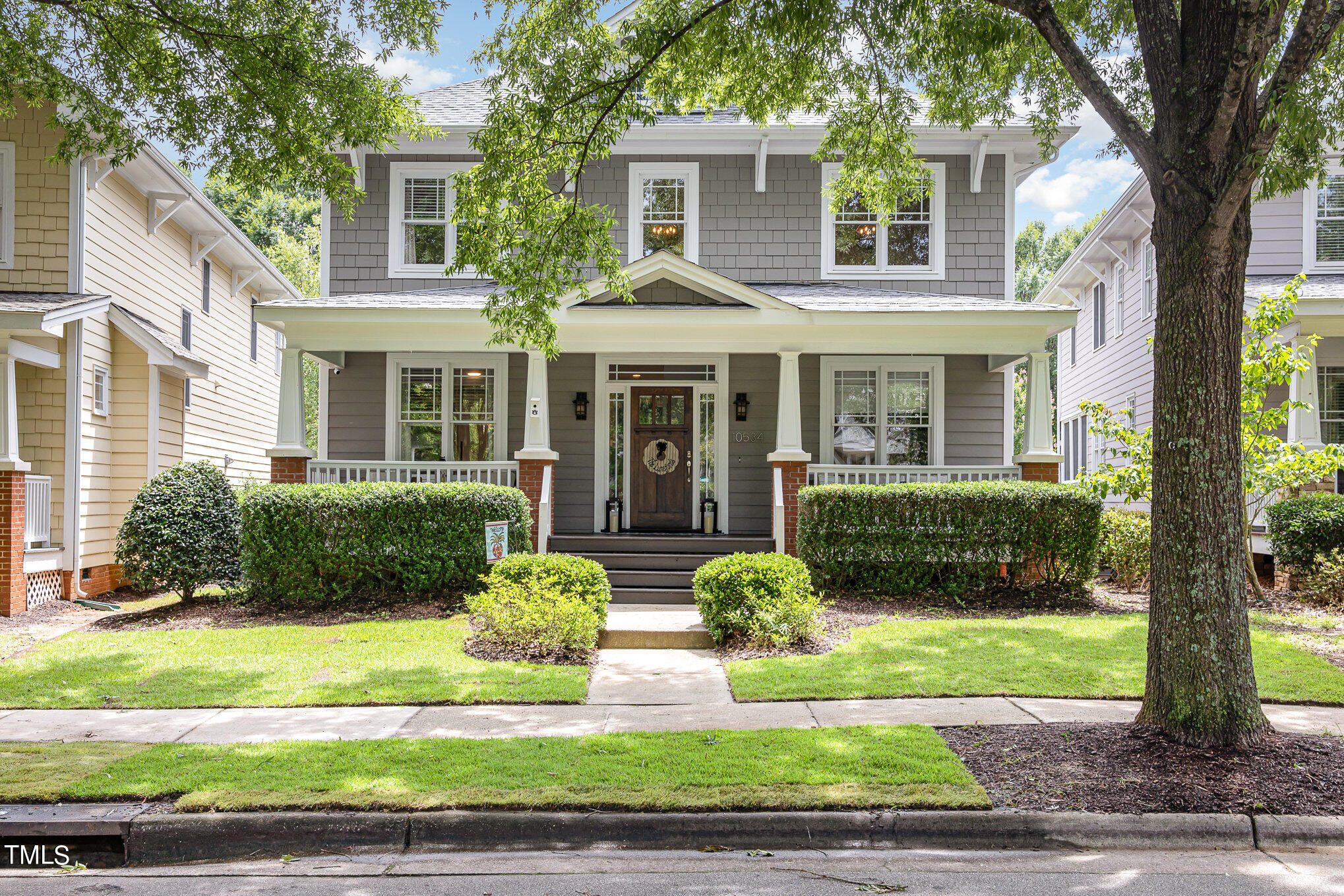 front view of a house that has a yard