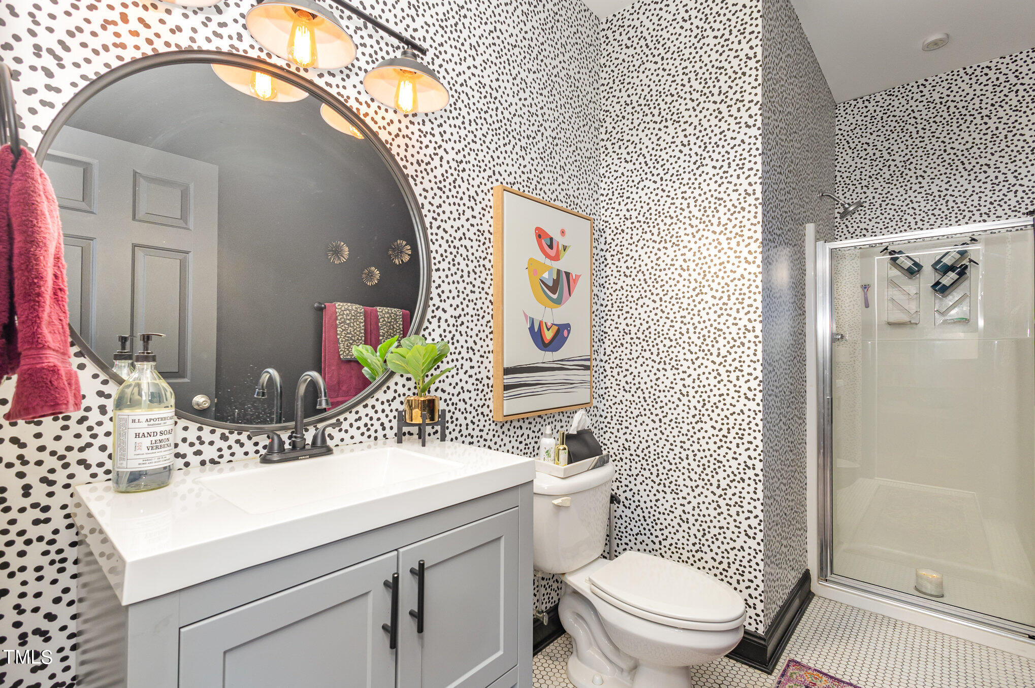 10534 Evergreen Spring Place Raleigh, NC 27614 - Photo 21 of 30 a bathroom with a sink a toilet and shower