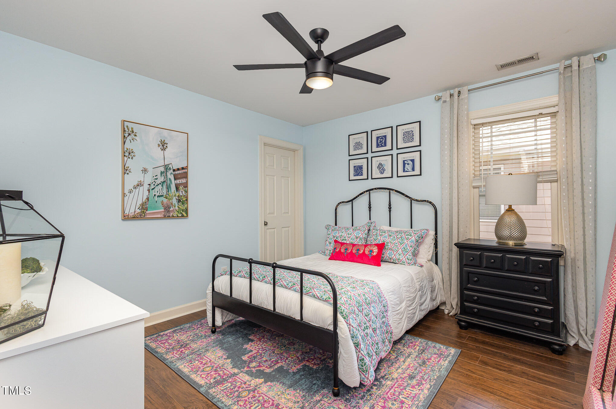10534 Evergreen Spring Place Raleigh, NC 27614 - Photo 23 of 30 a bedroom with a bed and a chandelier