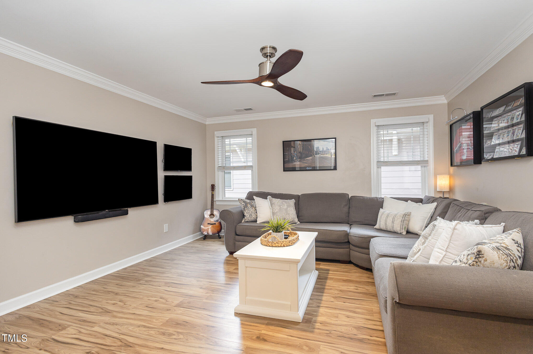 10534 Evergreen Spring Place Raleigh, NC 27614 - Photo 27 of 30 a living room with furniture and a flat screen tv