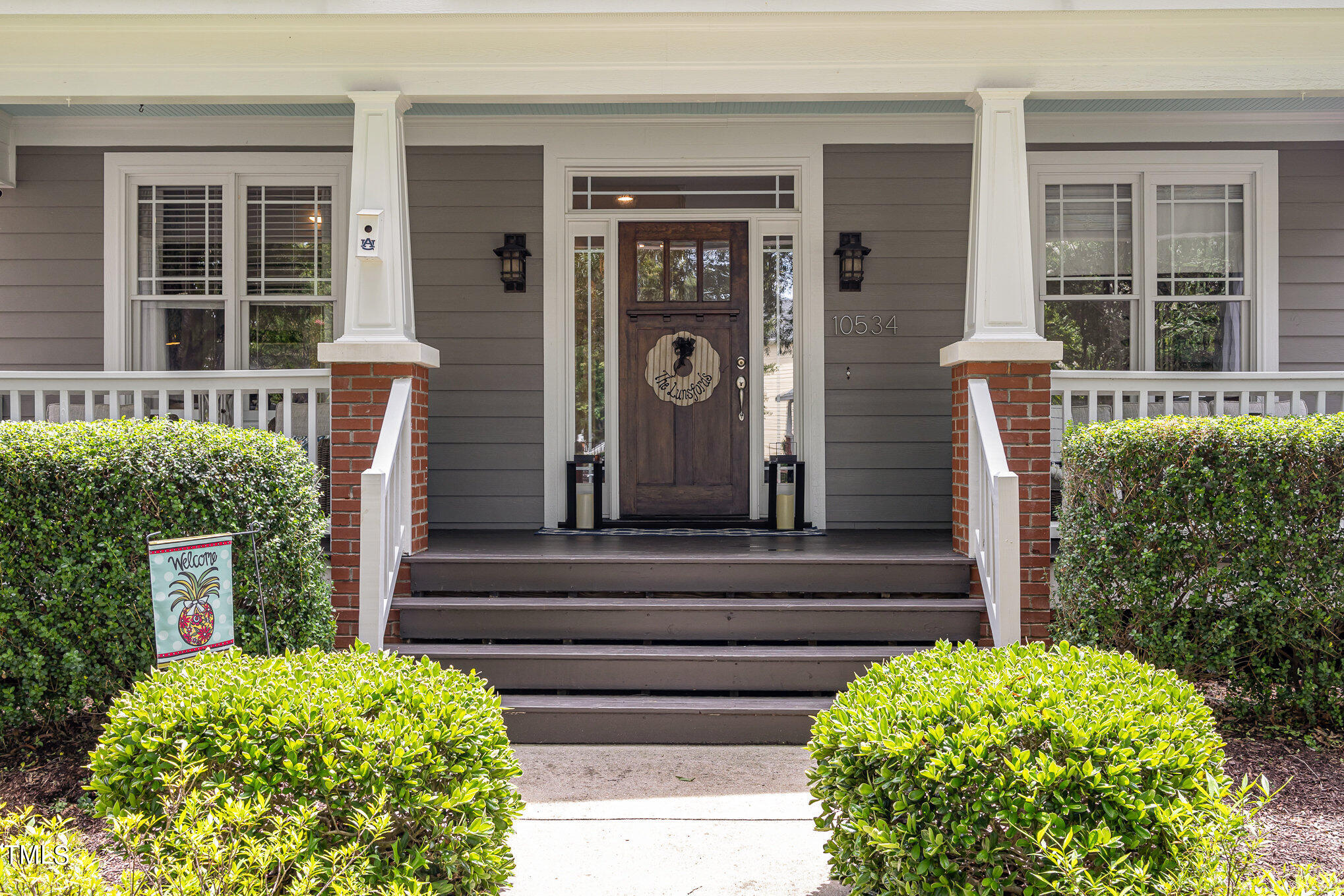 10534 Evergreen Spring Place Raleigh, NC 27614 - Photo 4 of 30 a front view of a house with garden