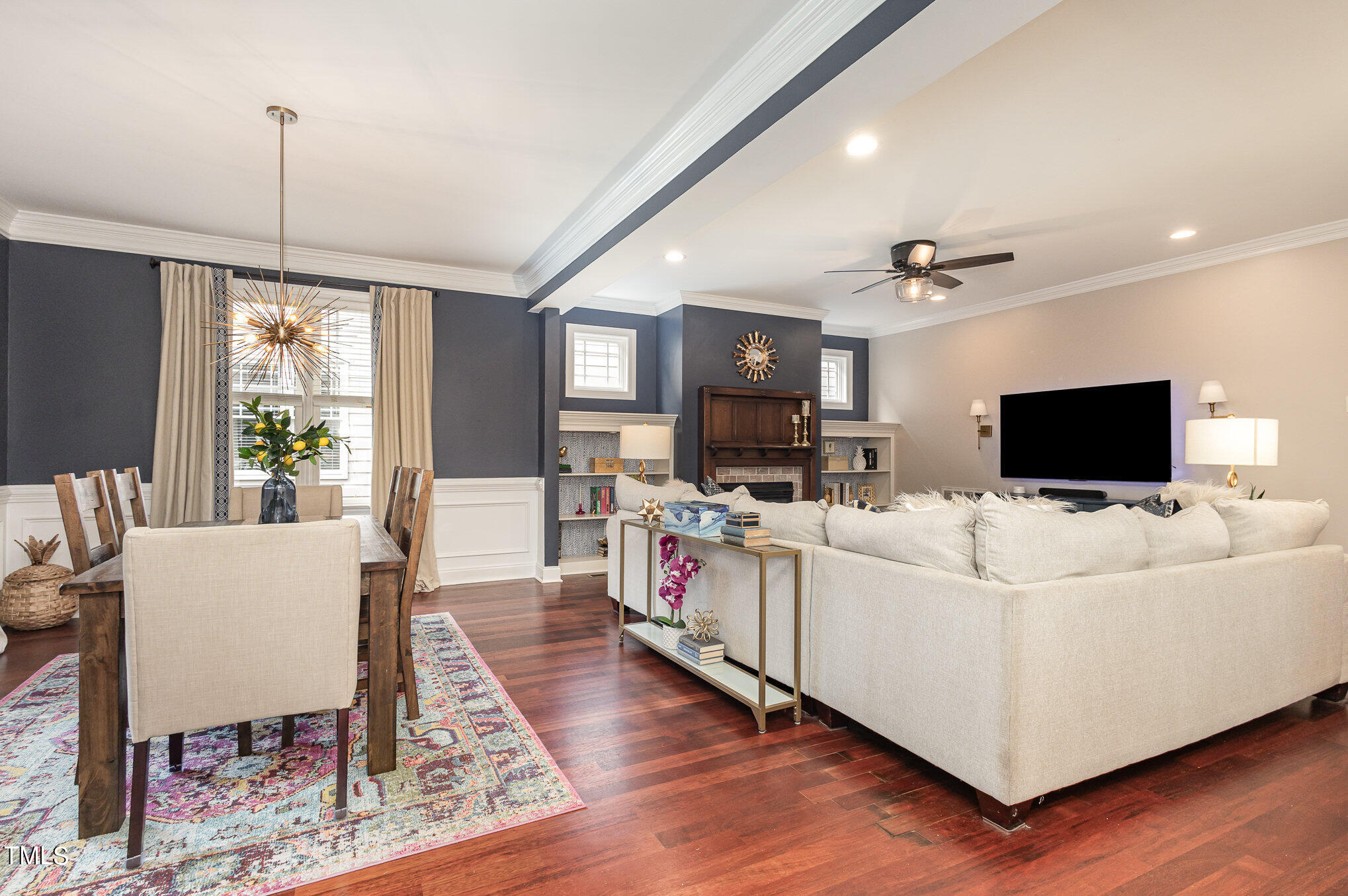 10534 Evergreen Spring Place Raleigh, NC 27614 - Photo 8 of 30 a living room with furniture and a flat screen tv