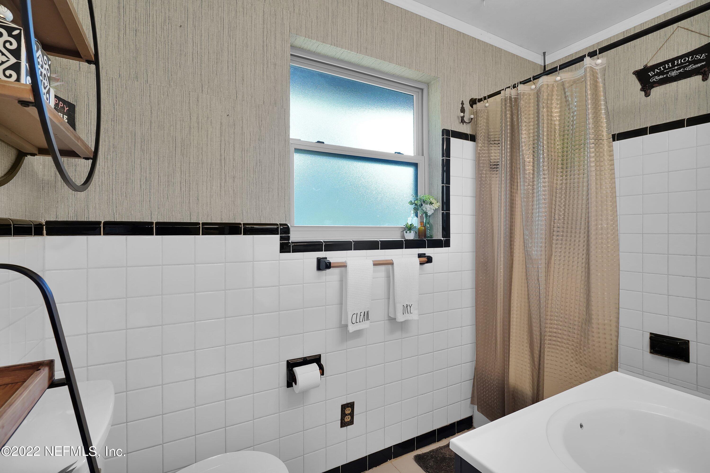 5329 Stanford Road Jacksonville, FL 32207 - Photo 11 of 28 a bathroom with a shower and a sink