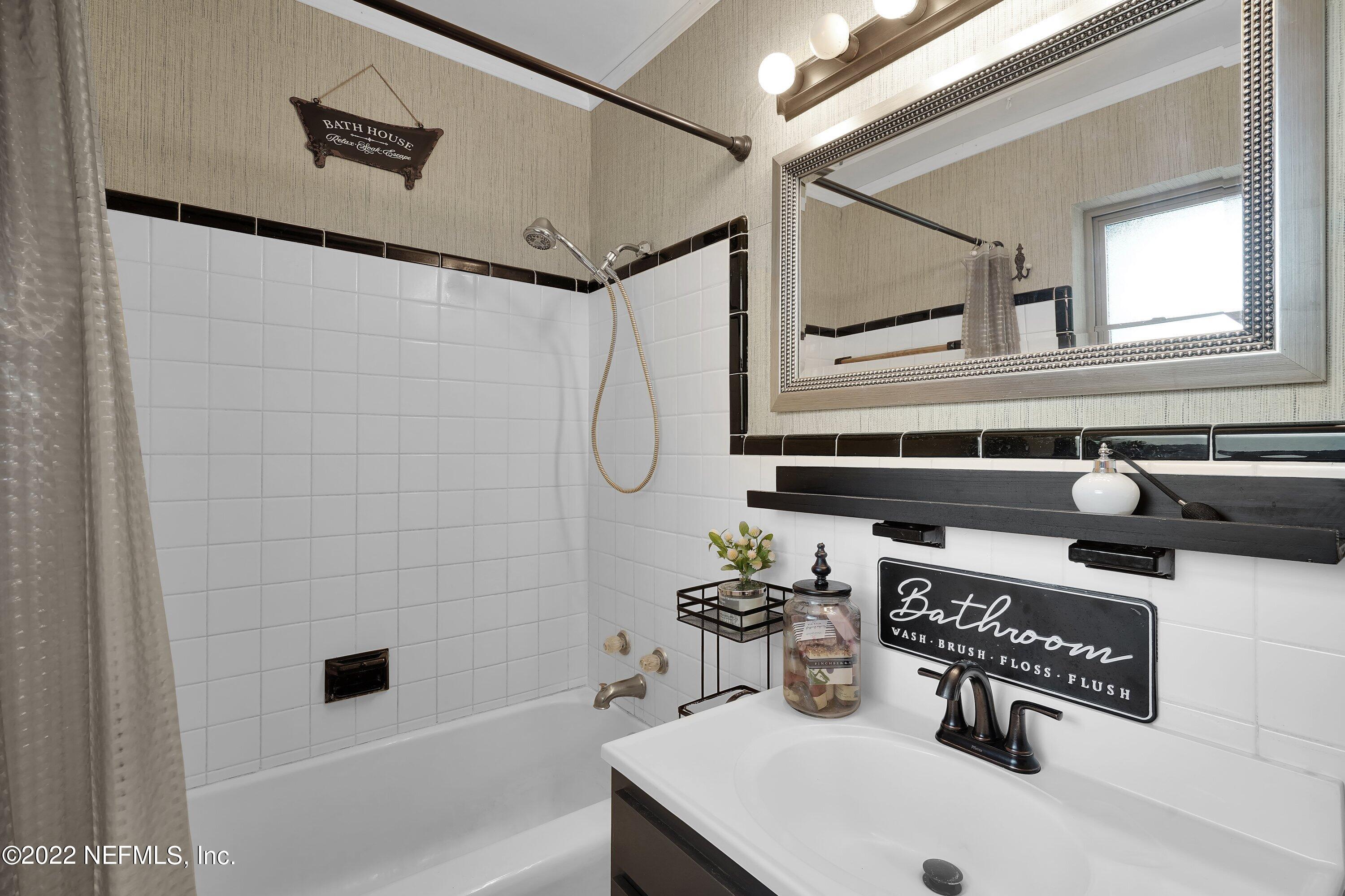 5329 Stanford Road Jacksonville, FL 32207 - Photo 12 of 28 a bathroom with a sink a toilet and shower