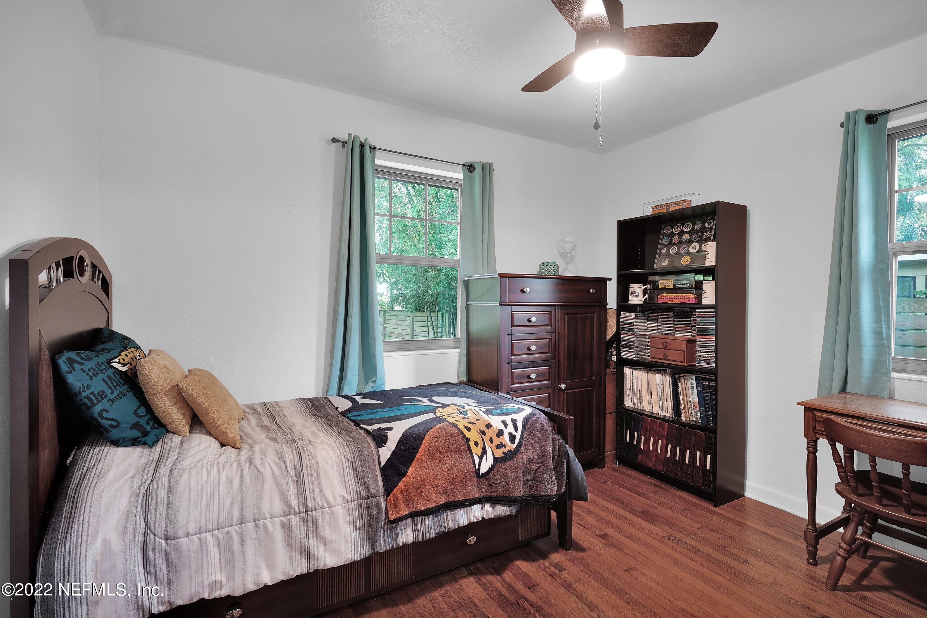 5329 Stanford Road Jacksonville, FL 32207 - Photo 13 of 28 a bedroom with a bed furniture and a window