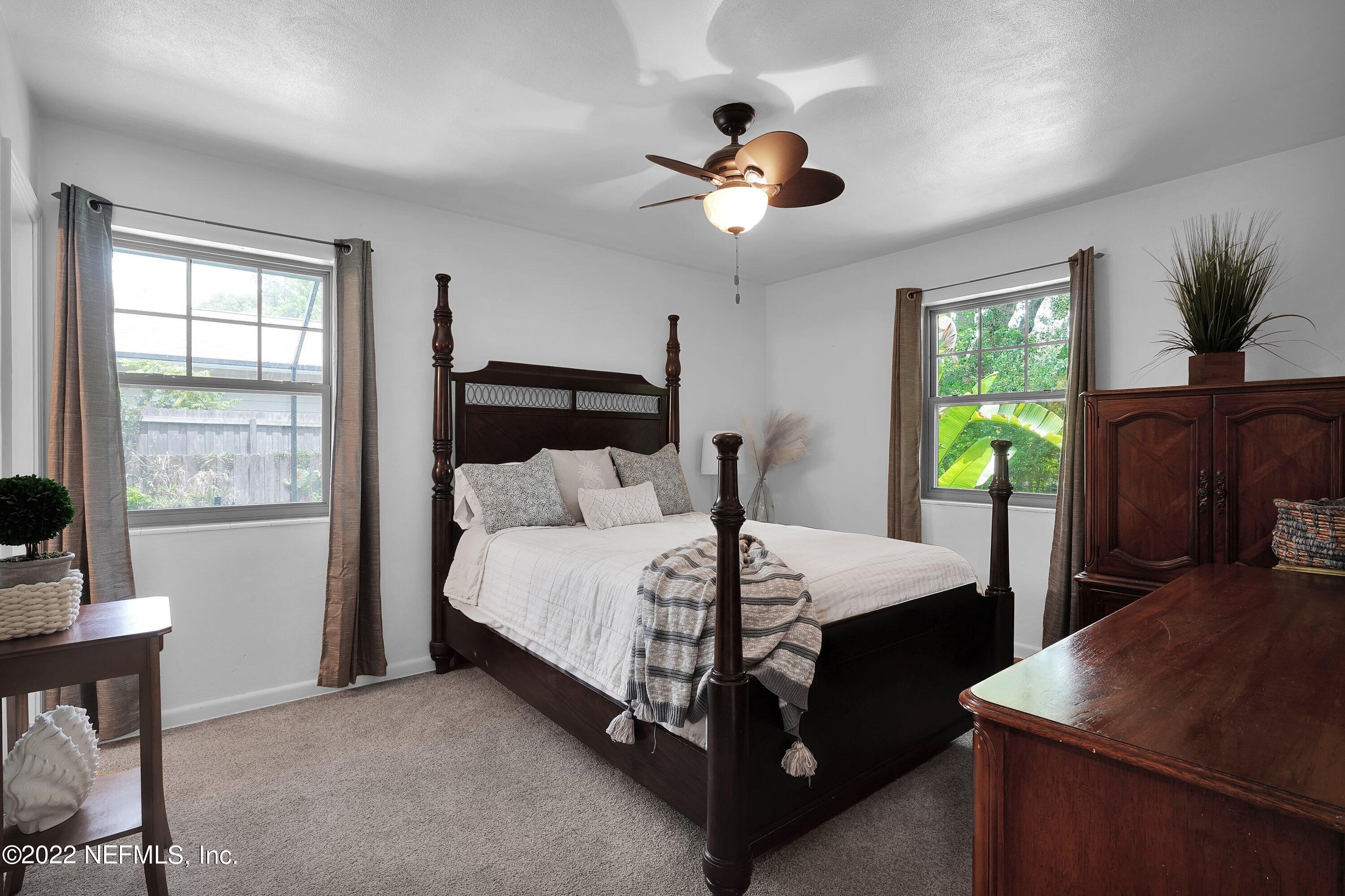 5329 Stanford Road Jacksonville, FL 32207 - Photo 14 of 28 a bedroom with a bed and a table