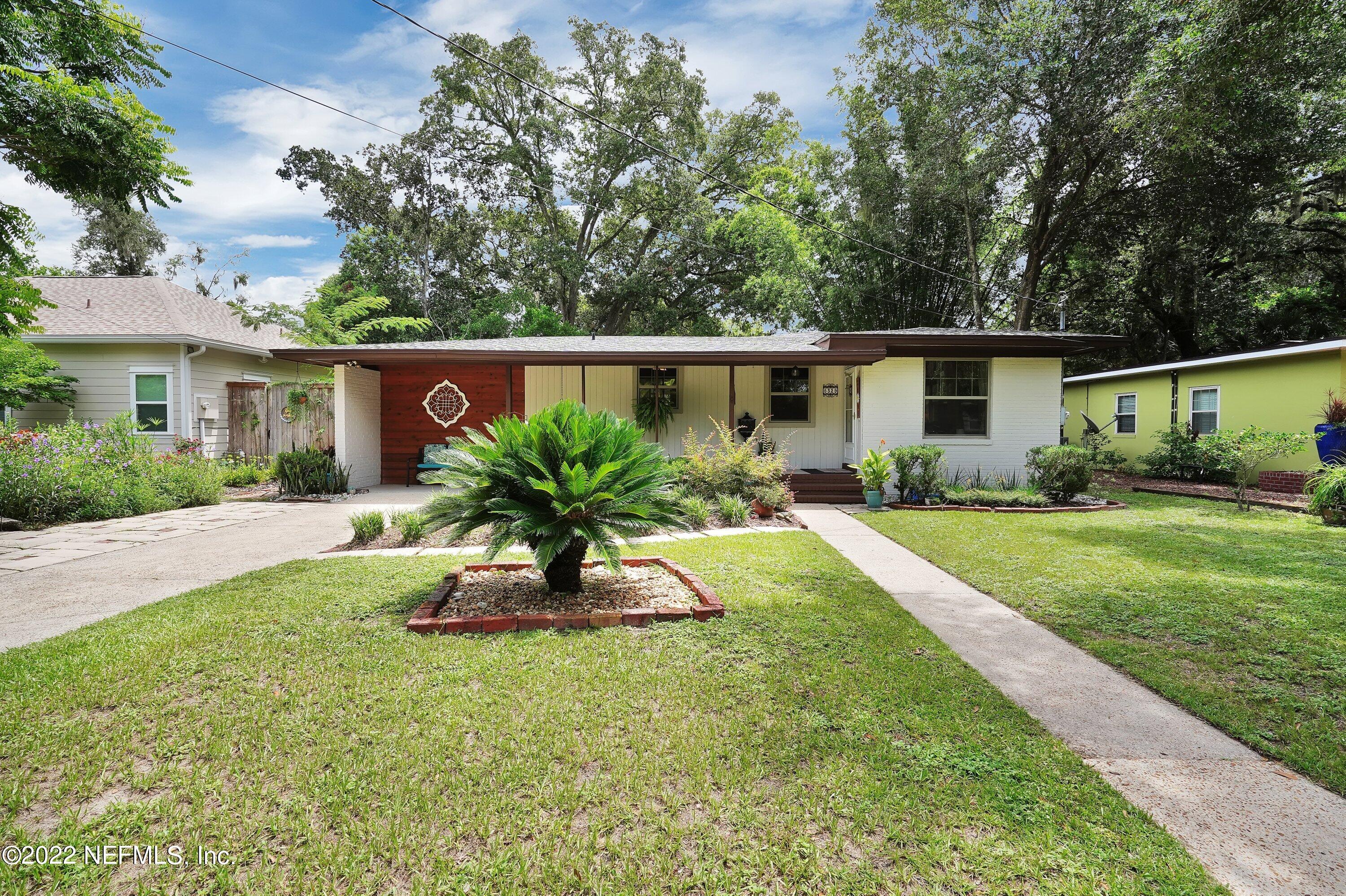 5329 Stanford Road Jacksonville, FL 32207 - Photo 2 of 28 a house view with a garden space