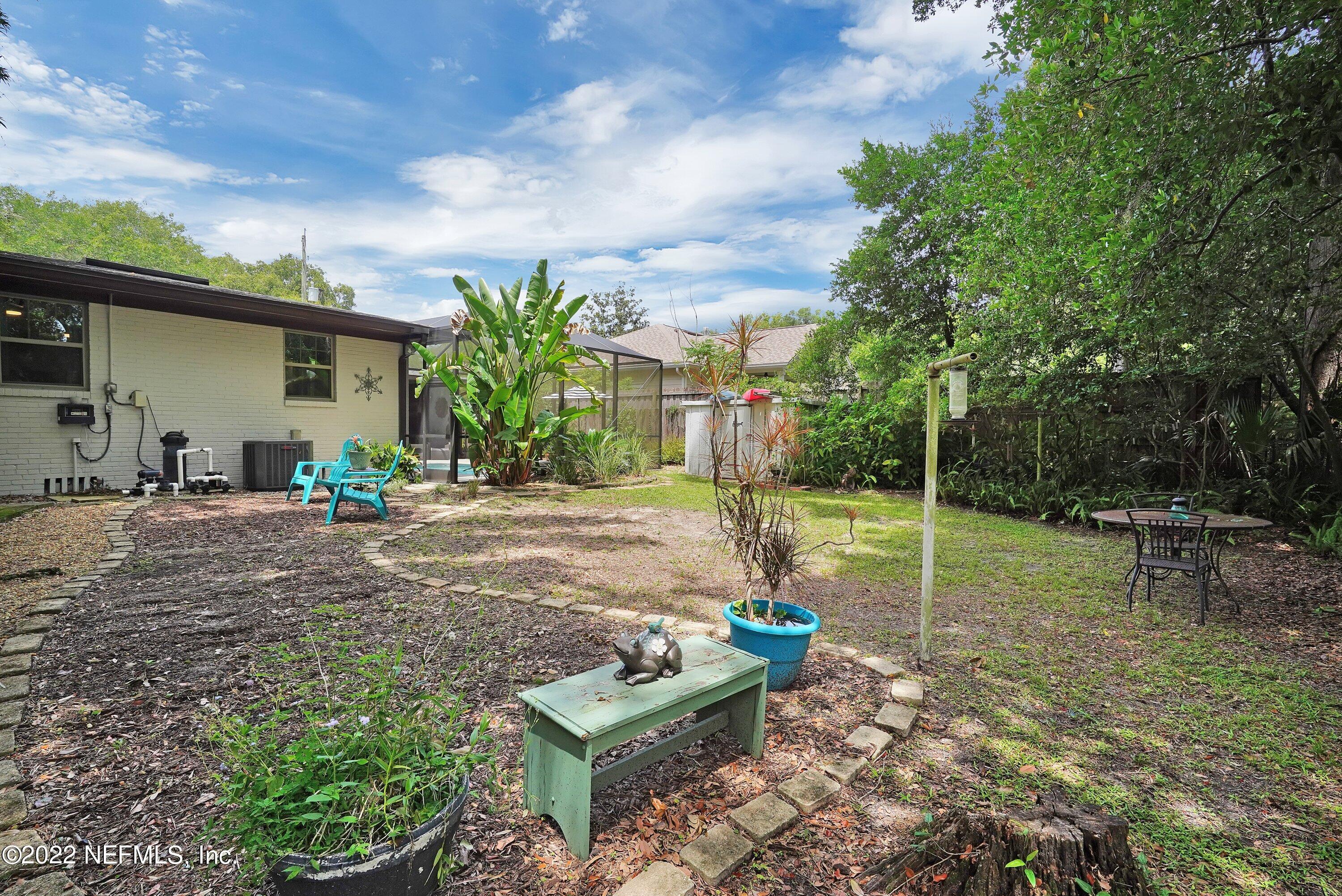 5329 Stanford Road Jacksonville, FL 32207 - Photo 27 of 28 a view of a backyard with plants and a patio