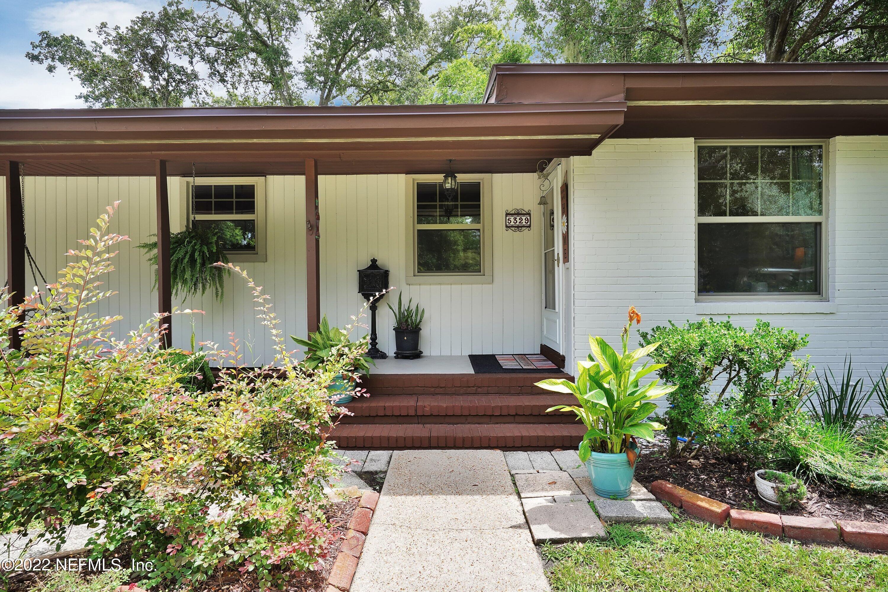 5329 Stanford Road Jacksonville, FL 32207 - Photo 5 of 28 a potted plant sitting in front of a house