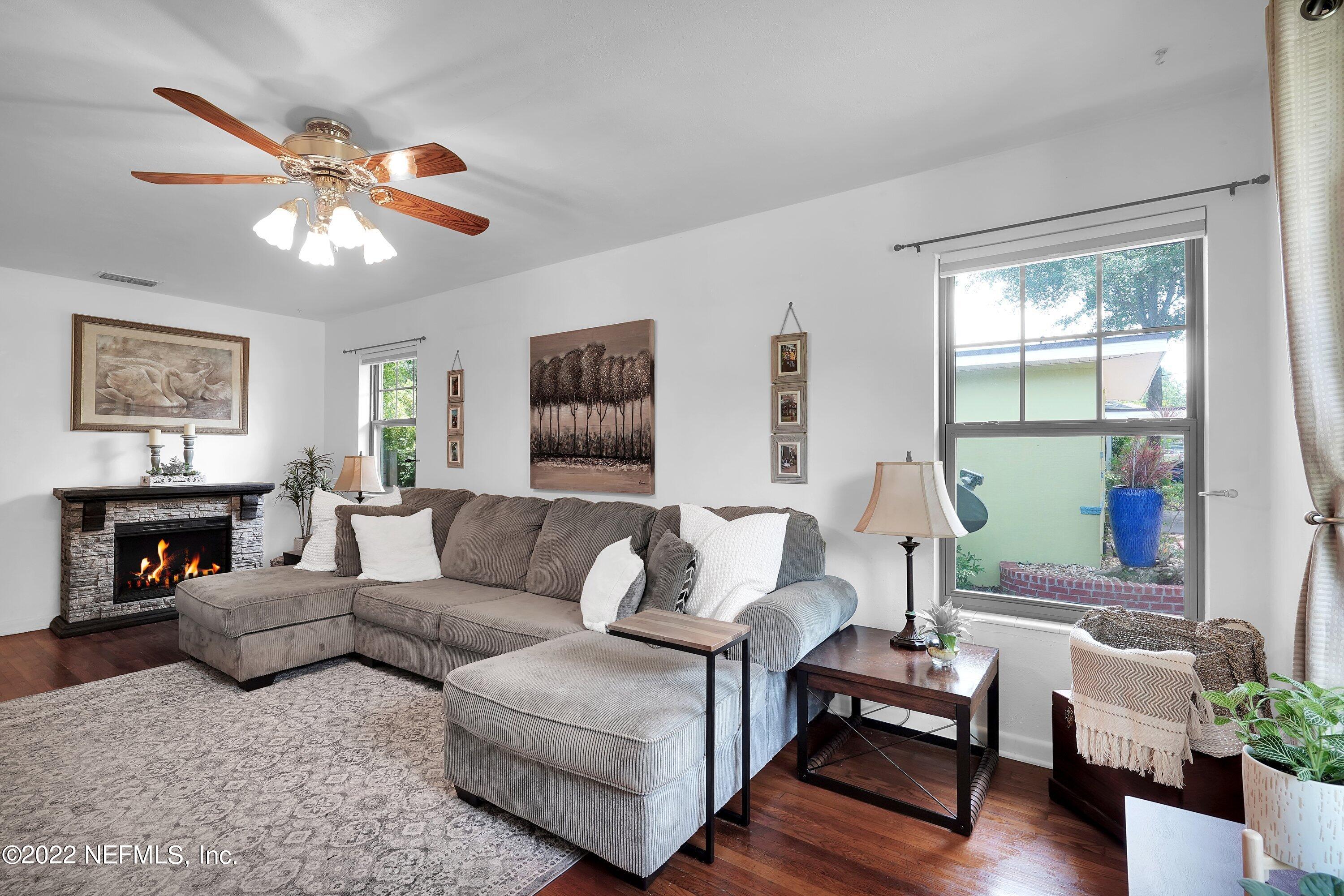 5329 Stanford Road Jacksonville, FL 32207 - Photo 7 of 28 a living room with furniture a table and a large window