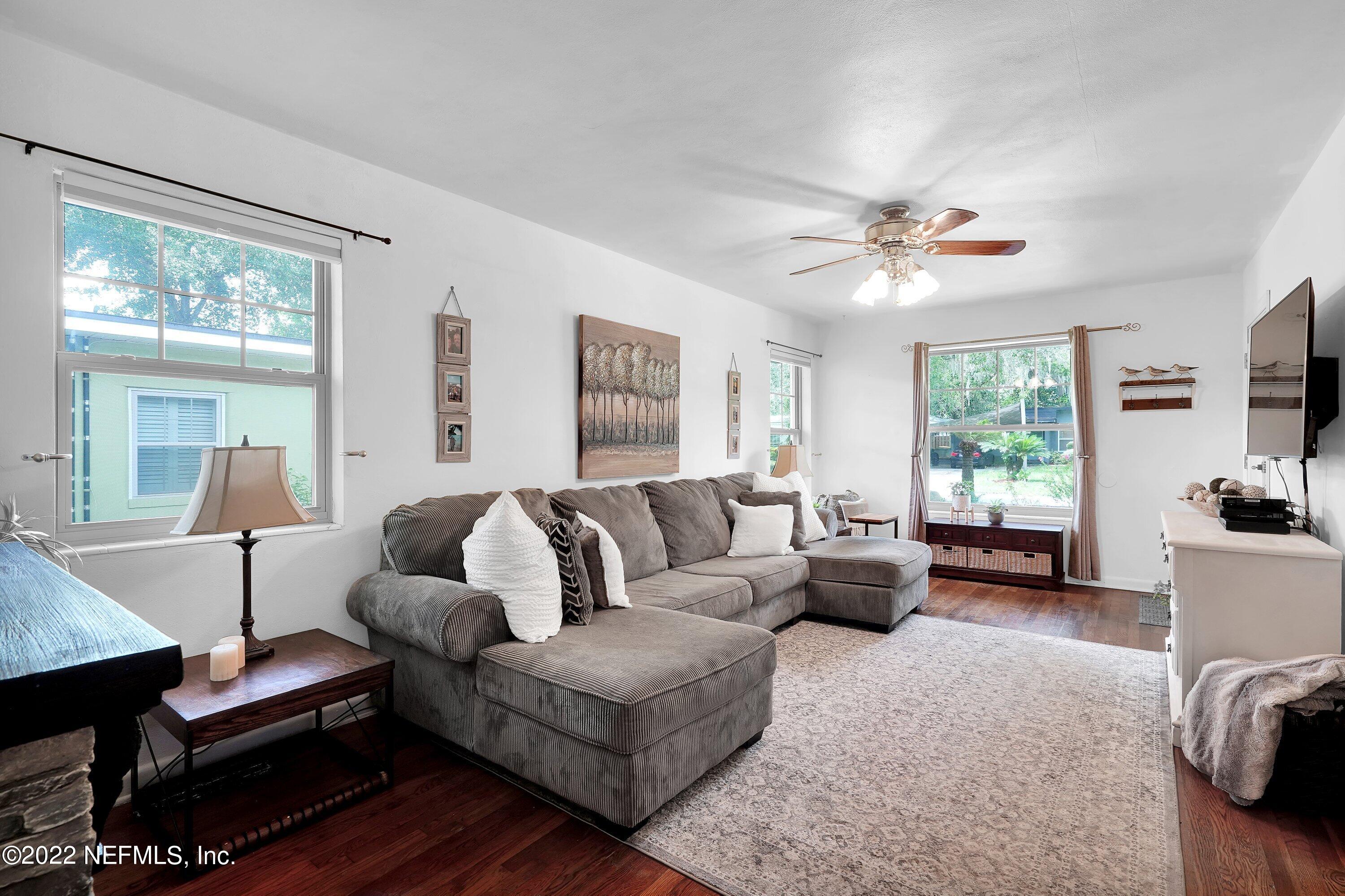 5329 Stanford Road Jacksonville, FL 32207 - Photo 9 of 28 a living room with furniture a table and a large window
