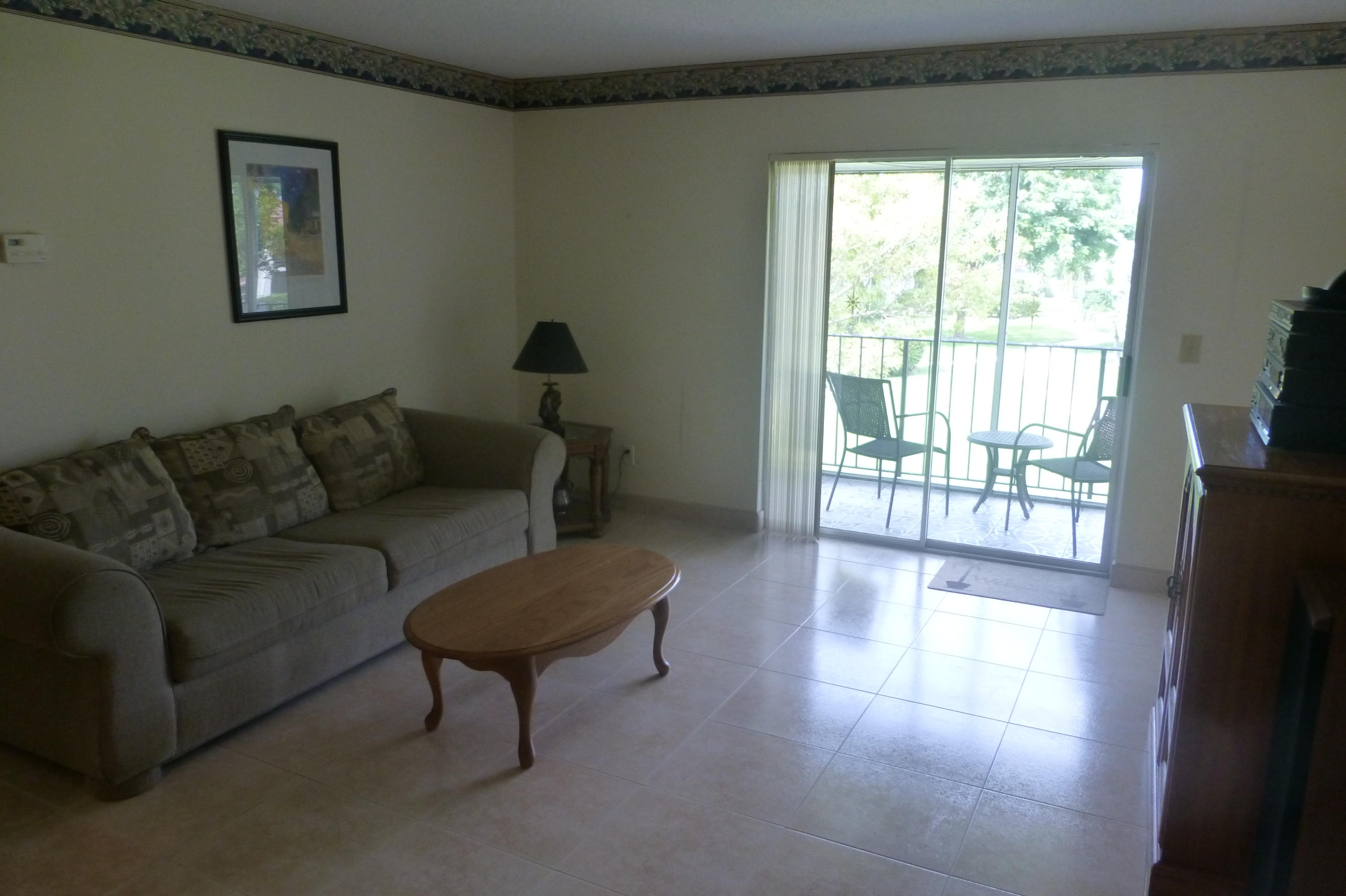 22785 Southwest 66th Avenue, Unit 208 Boca Raton, FL 33428 - Photo 2 of 15 Living Room and Balcony