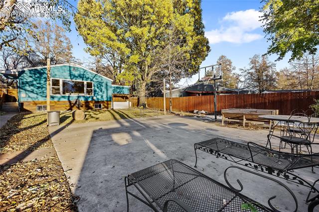 828 Valley Road Colorado Springs, CO 80904 - Photo 7 of 7 View of patio featuring basketball hoop