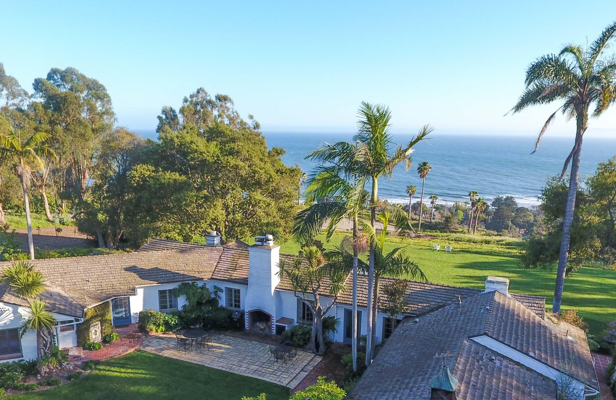 a view of a lake with a house in front of it