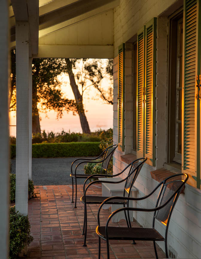 8316 Bates Road Ventura, CA 93001 - Photo 5 of 25 a balcony view with table and chairs and wooden floor with a lake view