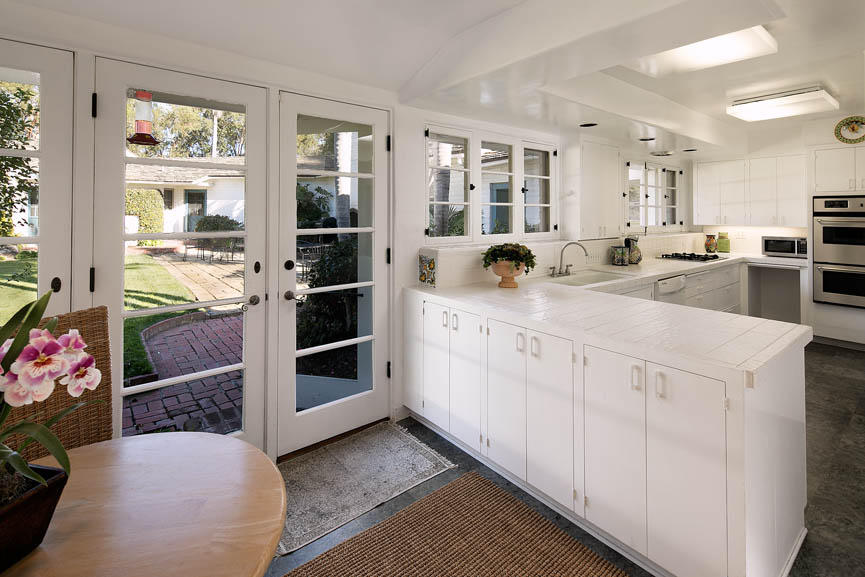 8316 Bates Road Ventura, CA 93001 - Photo 9 of 25 a kitchen with stainless steel appliances kitchen island granite countertop a refrigerator and a stove