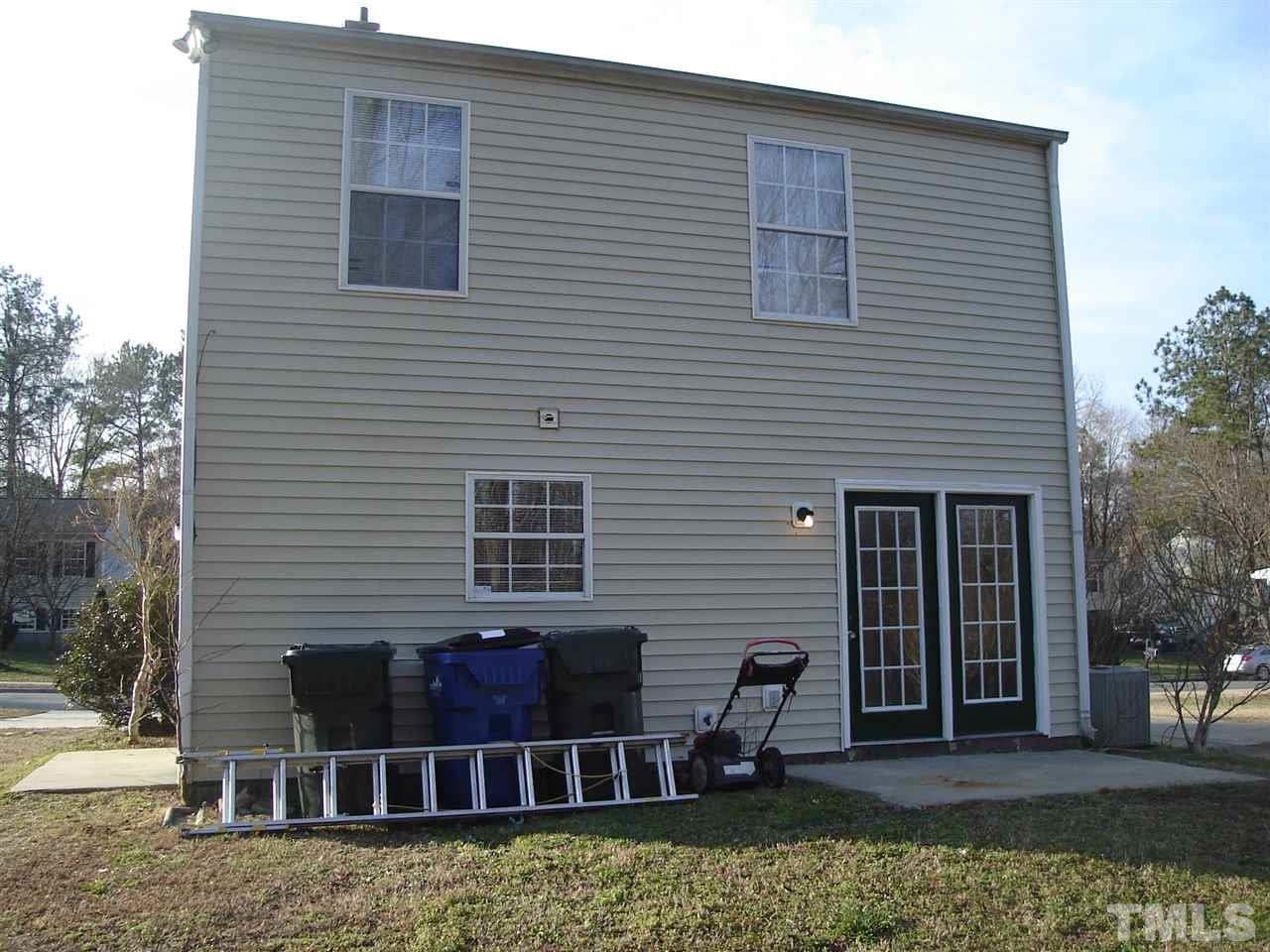 5833 Chatmoss Drive Raleigh, NC 27610 - Photo 4 of 10 a view of a house with two chairs in a patio