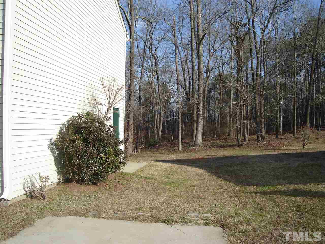 5833 Chatmoss Drive Raleigh, NC 27610 - Photo 5 of 10 a view of a backyard with large trees
