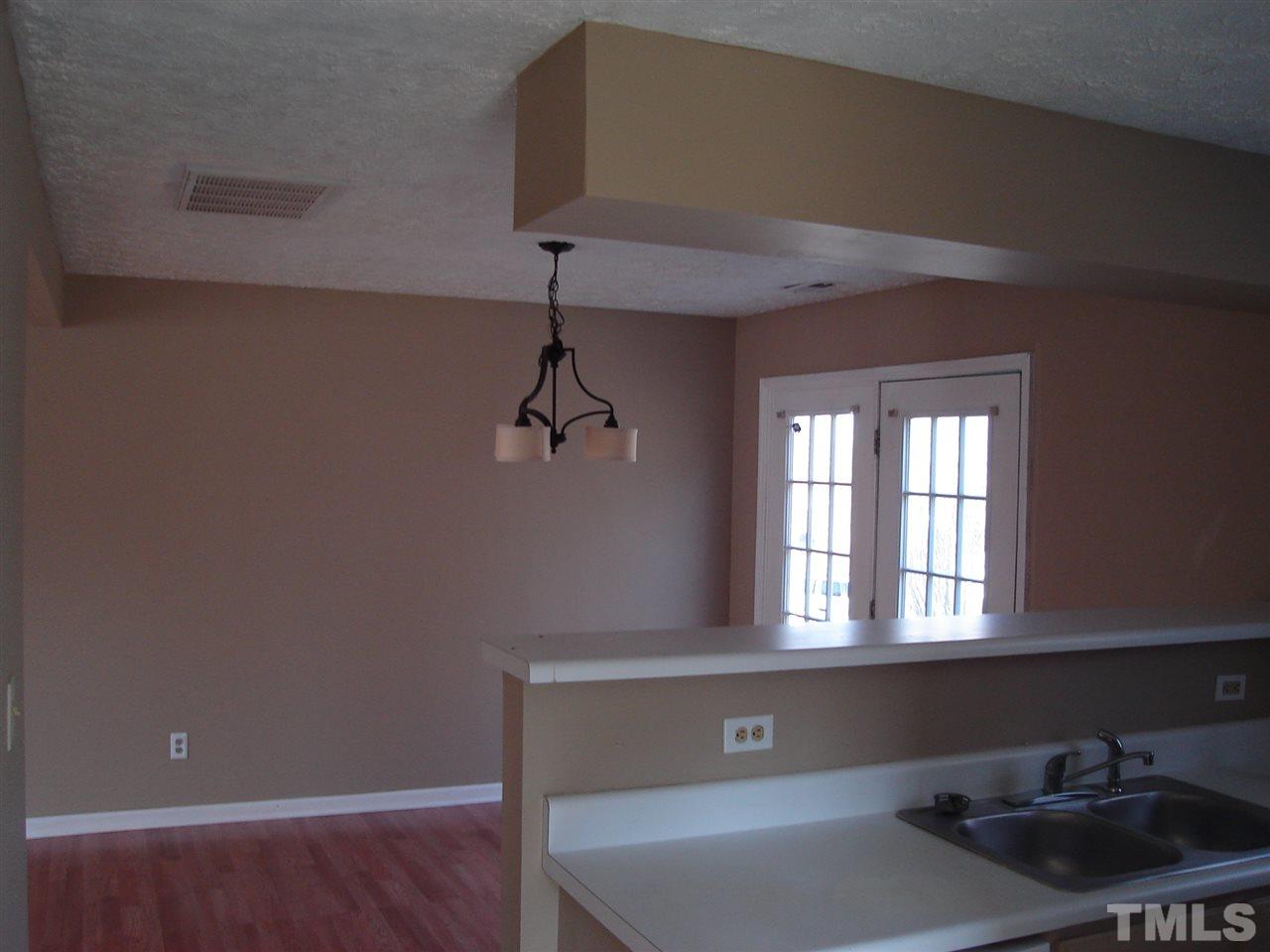 5833 Chatmoss Drive Raleigh, NC 27610 - Photo 7 of 10 a view of an empty room with a window