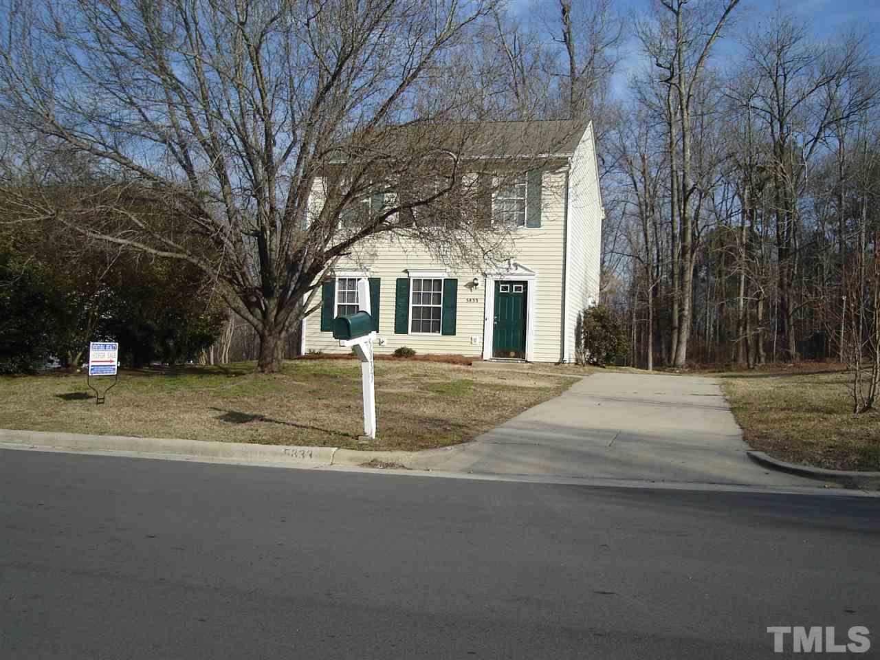5833 Chatmoss Drive Raleigh, NC 27610 - Photo 8 of 10 a front view of a house with a yard