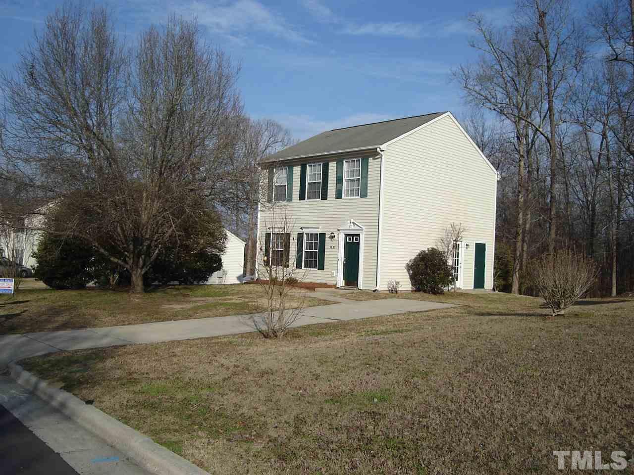 5833 Chatmoss Drive Raleigh, NC 27610 - Photo 9 of 10 a view of a house with a yard