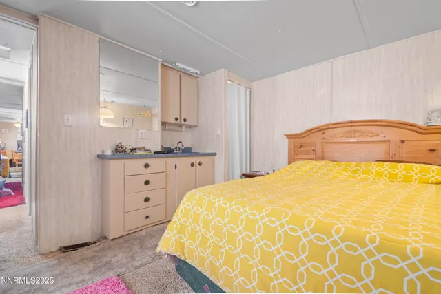 a bedroom with a bed and a cabinets