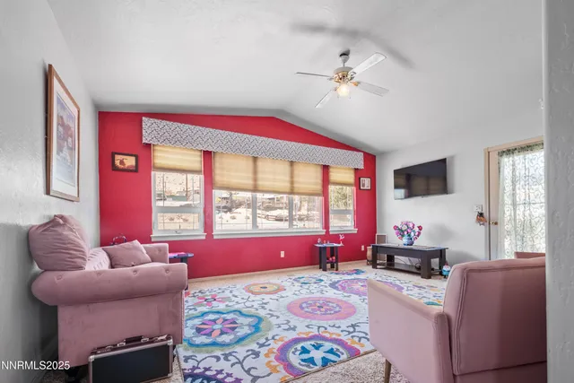 a bedroom with furniture and a window
