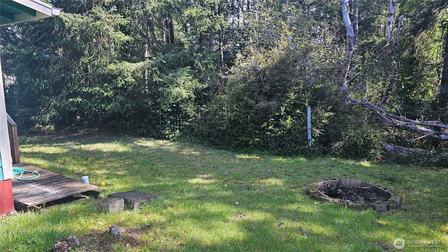 24402 P Street Ocean Park, WA 98640 - Photo 12 of 40 a backyard of a house with lots of green space