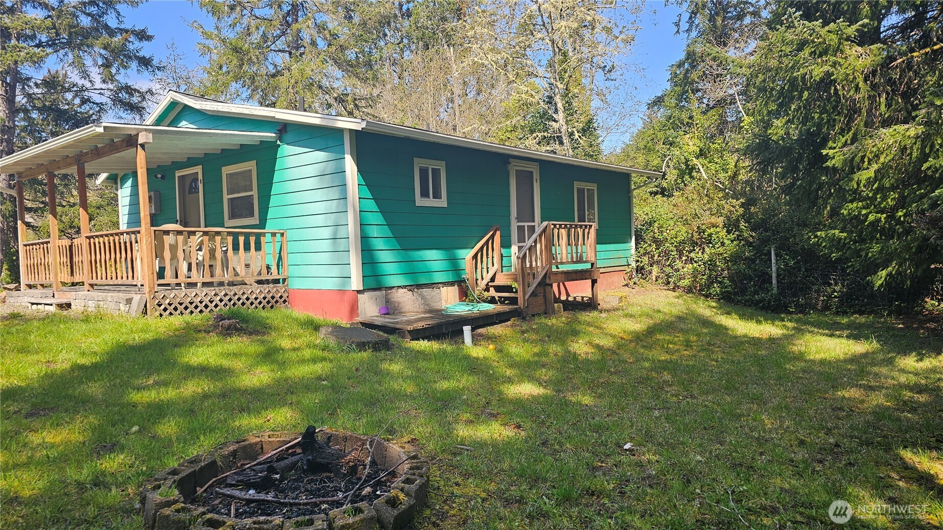 24402 P Street Ocean Park, WA 98640 - Photo 17 of 40 a view of a house with backyard and sitting area
