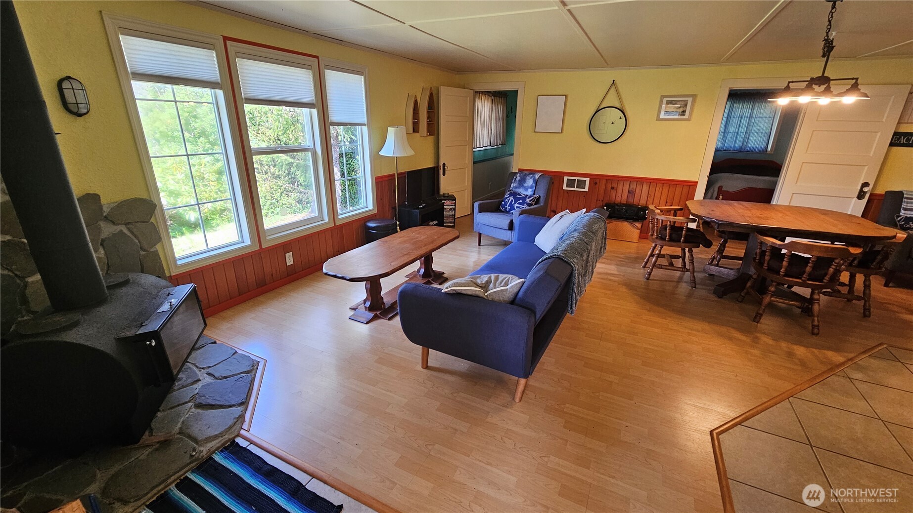 24402 P Street Ocean Park, WA 98640 - Photo 27 of 40 a living room with furniture a flat screen tv and a large window