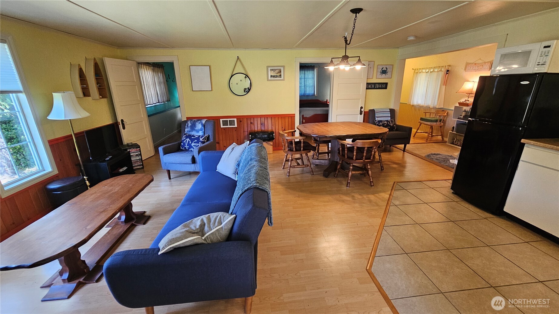 24402 P Street Ocean Park, WA 98640 - Photo 28 of 40 a living room with furniture a flat screen tv and a large window
