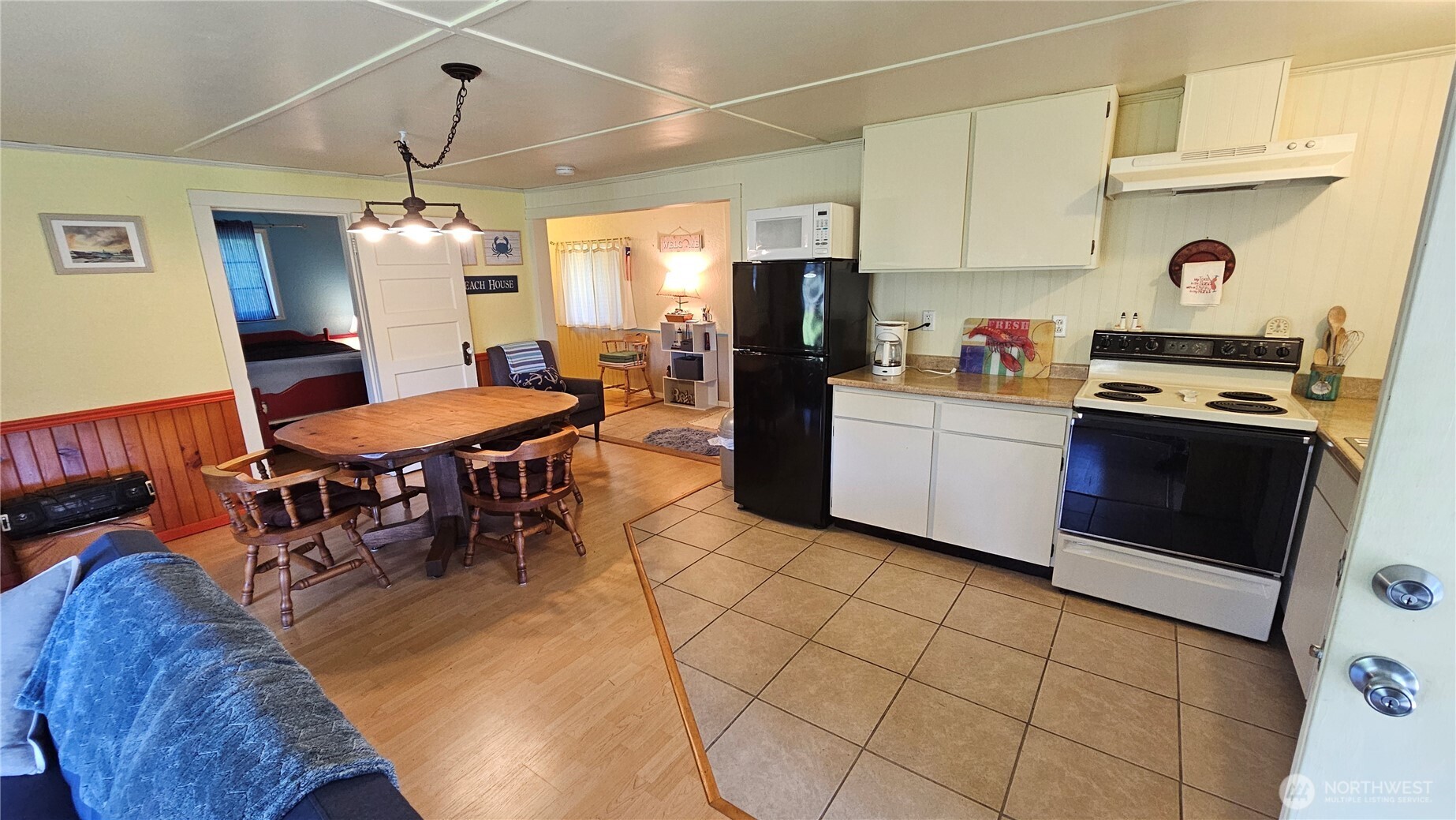 24402 P Street Ocean Park, WA 98640 - Photo 29 of 40 a kitchen with stainless steel appliances kitchen island granite countertop a sink and cabinets