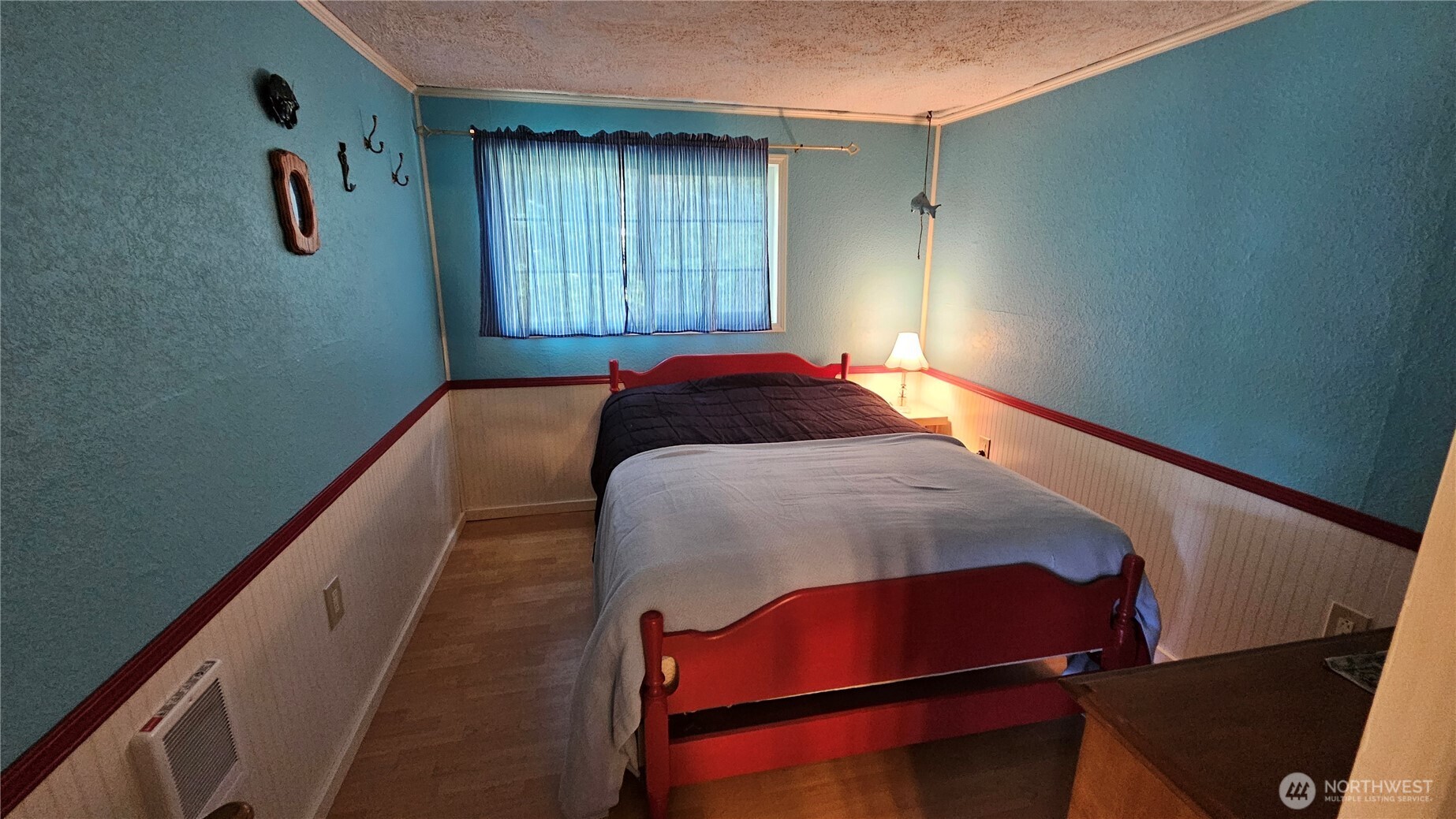 24402 P Street Ocean Park, WA 98640 - Photo 33 of 40 a bedroom with a bed and a window