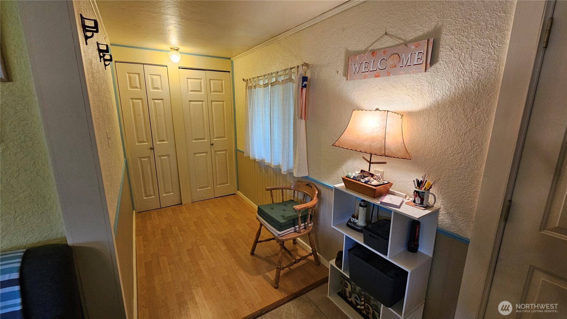 24402 P Street Ocean Park, WA 98640 - Photo 36 of 40 a bathroom with a sink a light fixture and a glass door
