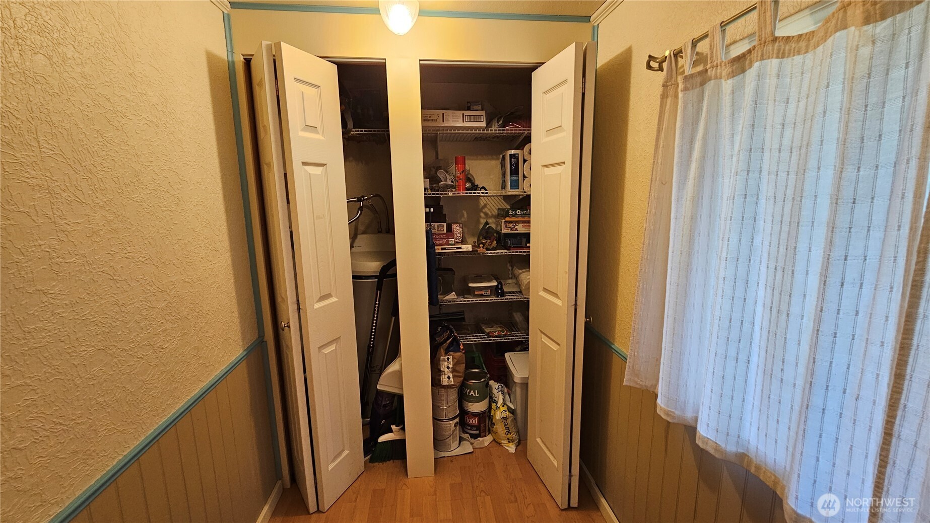 24402 P Street Ocean Park, WA 98640 - Photo 37 of 40 a view of walk in closet with clothes