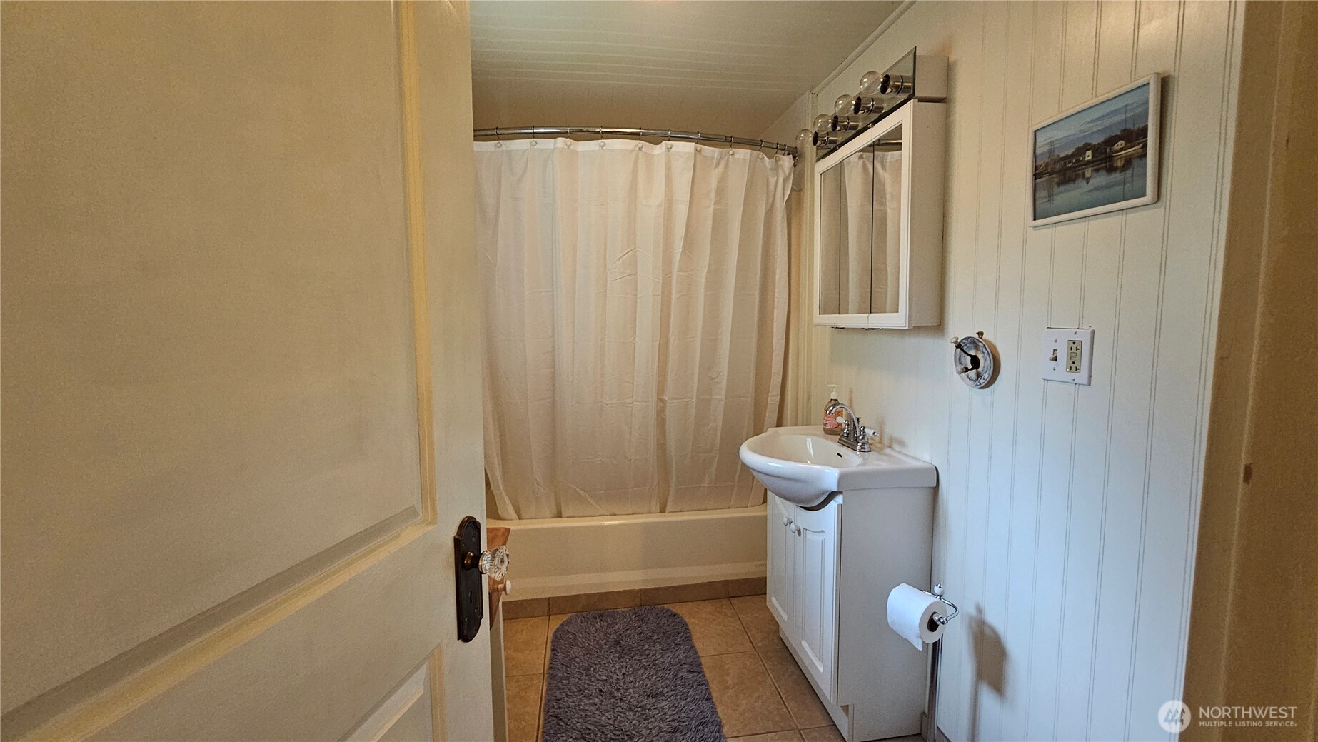 24402 P Street Ocean Park, WA 98640 - Photo 39 of 40 a bathroom with a sink a toilet and shower