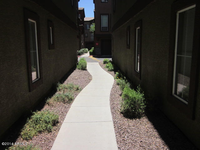 1920 East Bell Road, Unit 1037 Phoenix, AZ 85022 - Photo 15 of 24 ALLEY BETWEEN BUILDINGS