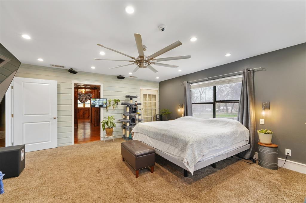 1051 Lynch Bend Road Springtown, TX 76082 - Photo 4 of 39 a bed room with a bed and a large window
